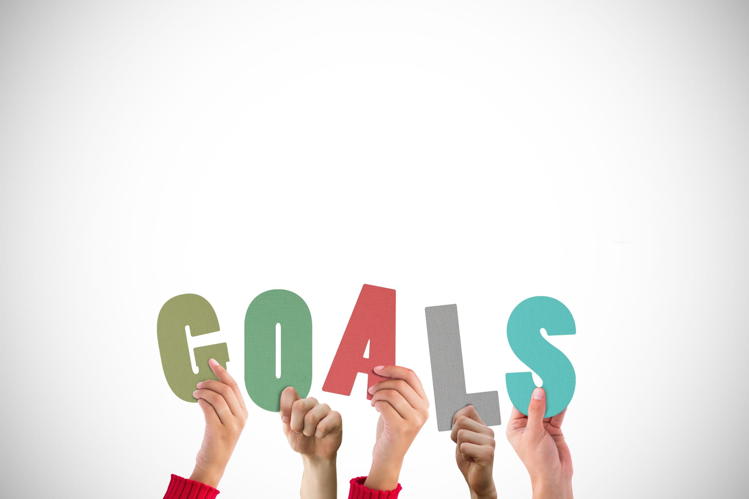 SMART goals written in a notebook using the achievable goalsetting framework