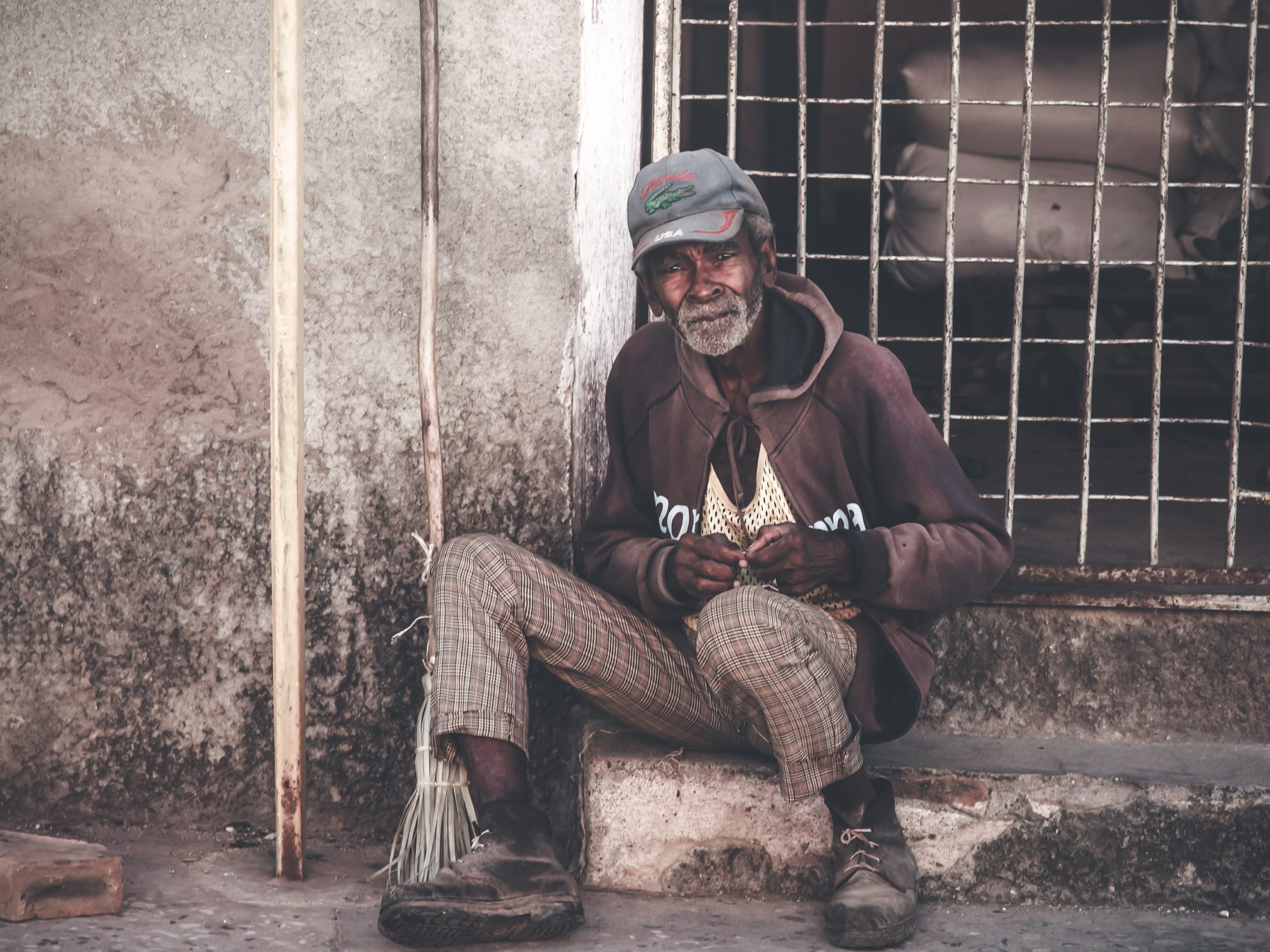 Photo by Mehmet Turgut Kirkgoz : https://www.pexels.com/photo/poor-senior-asian-man-sitting-on-street-5874244/