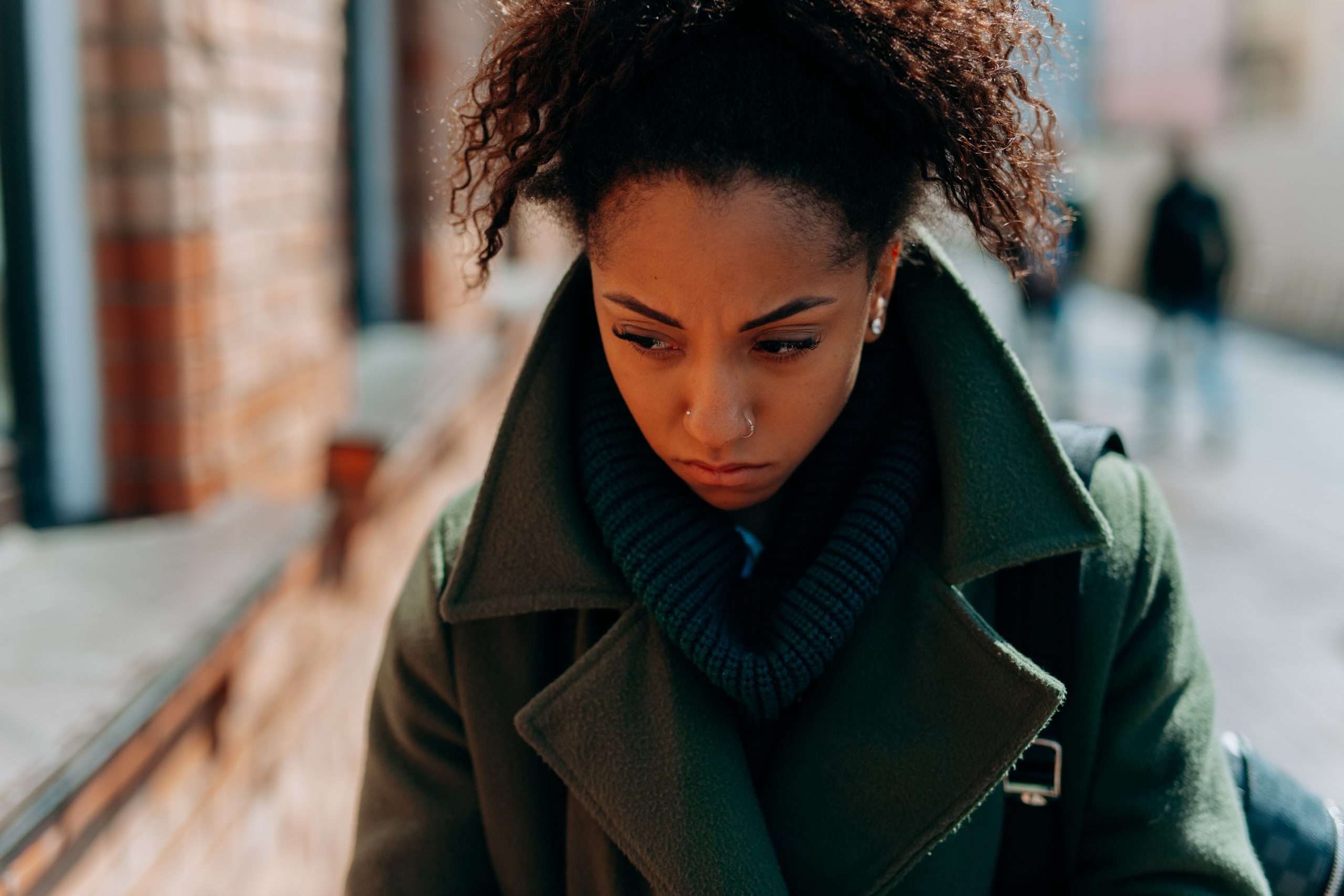 Photo by Mikhail Nilov: https://www.pexels.com/photo/close-up-photo-of-a-lonely-woman-in-green-trench-coat-7929587/