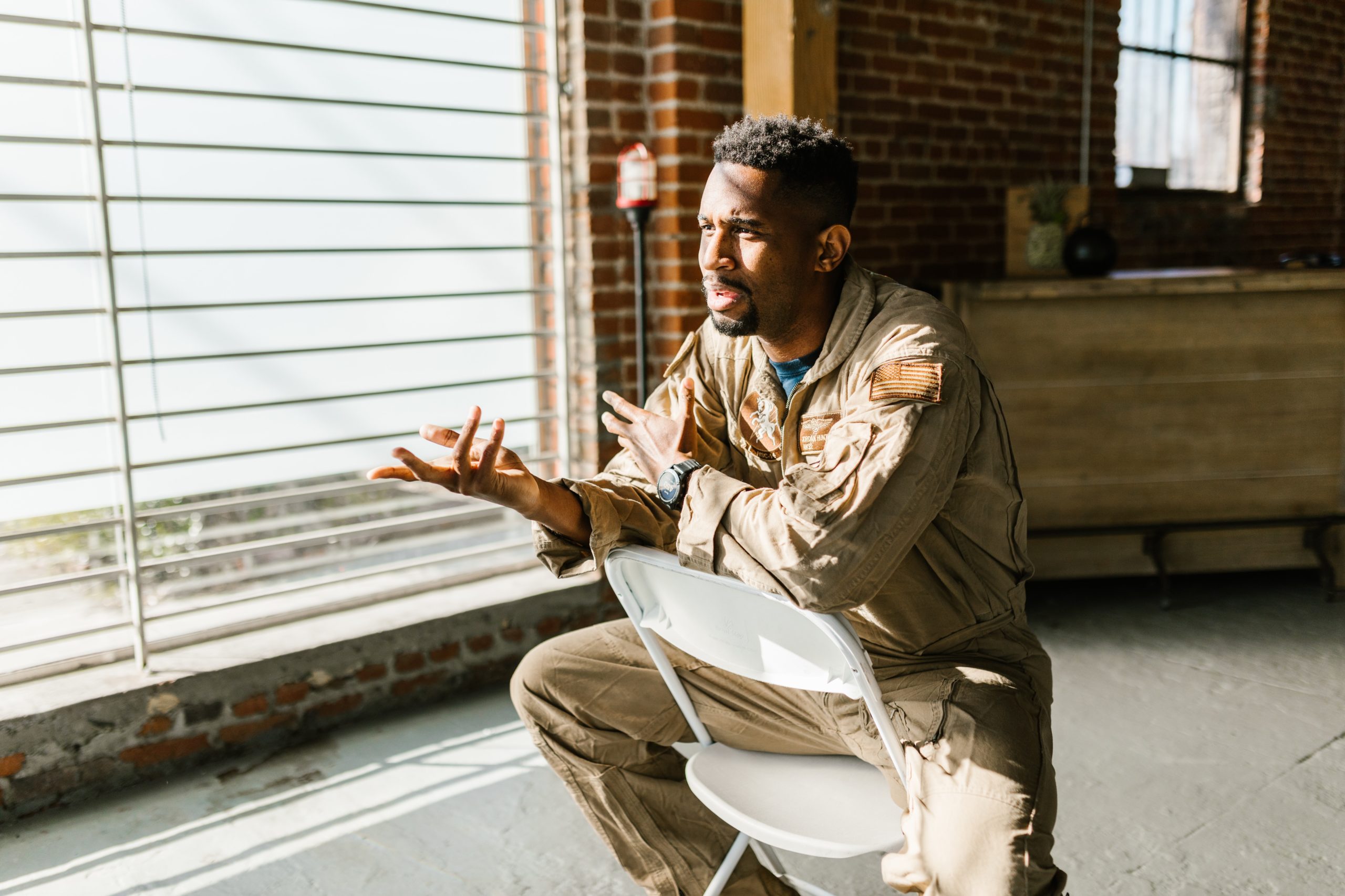 Photo by RODNAE Productions: https://www.pexels.com/photo/photo-of-soldier-sitting-on-a-folding-chair-7468071/