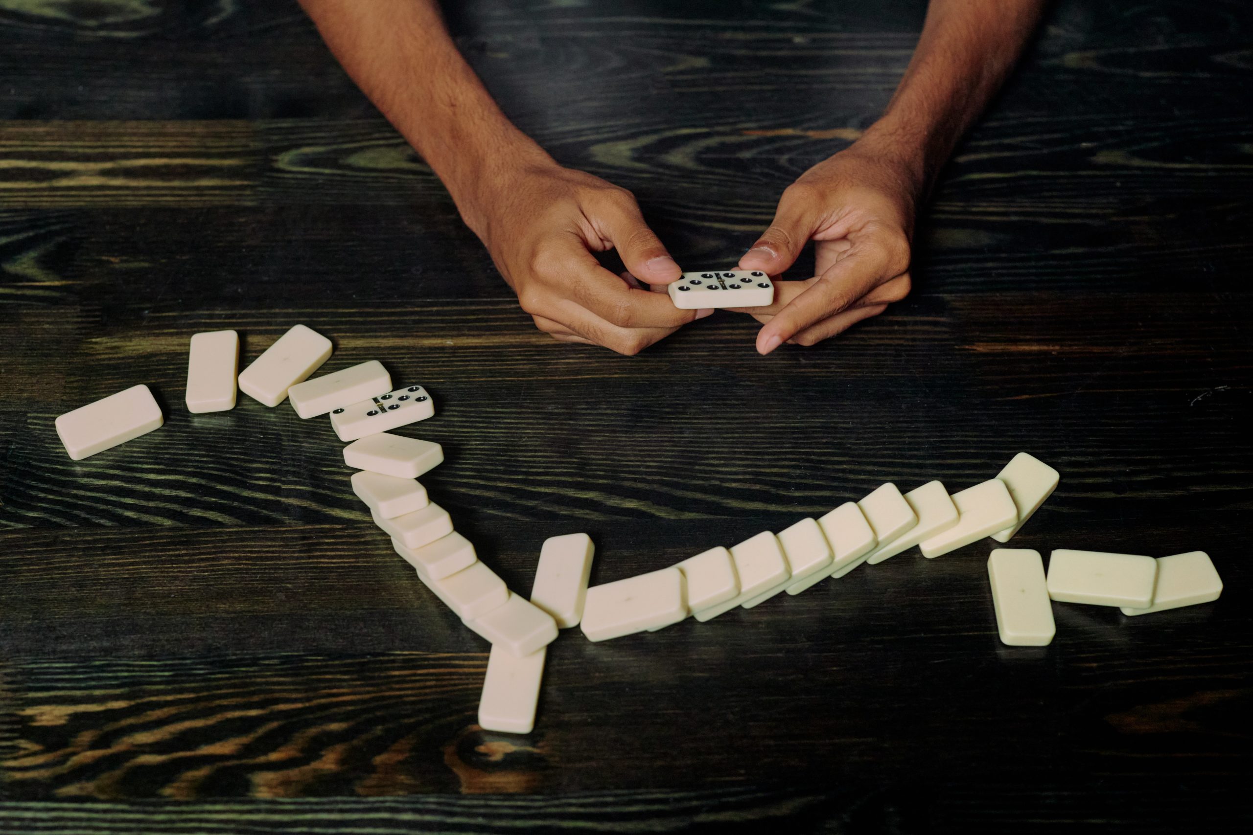 Photo by Ron Lach : https://www.pexels.com/photo/hands-holding-one-of-the-domino-blocks-9760557/